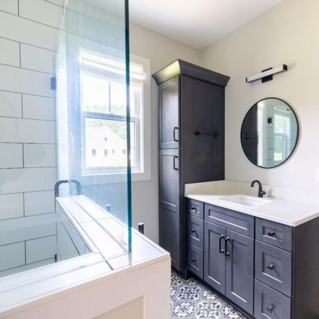 a new bathroom with black cabinets