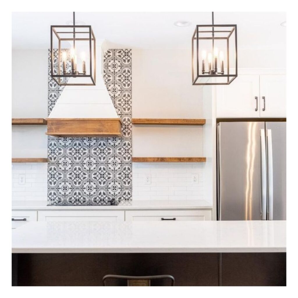 A modern kitchen with wire chandeliers