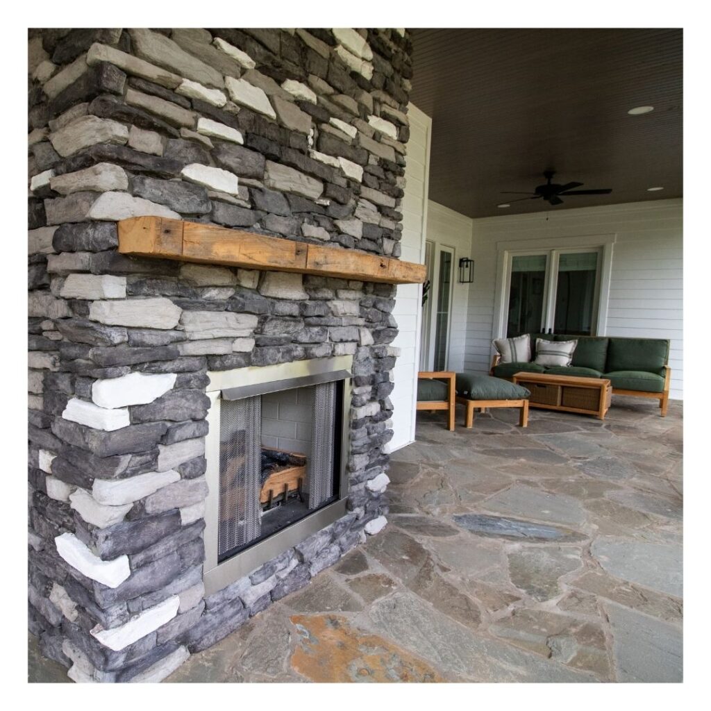 A rustic stone outdoor fireplace