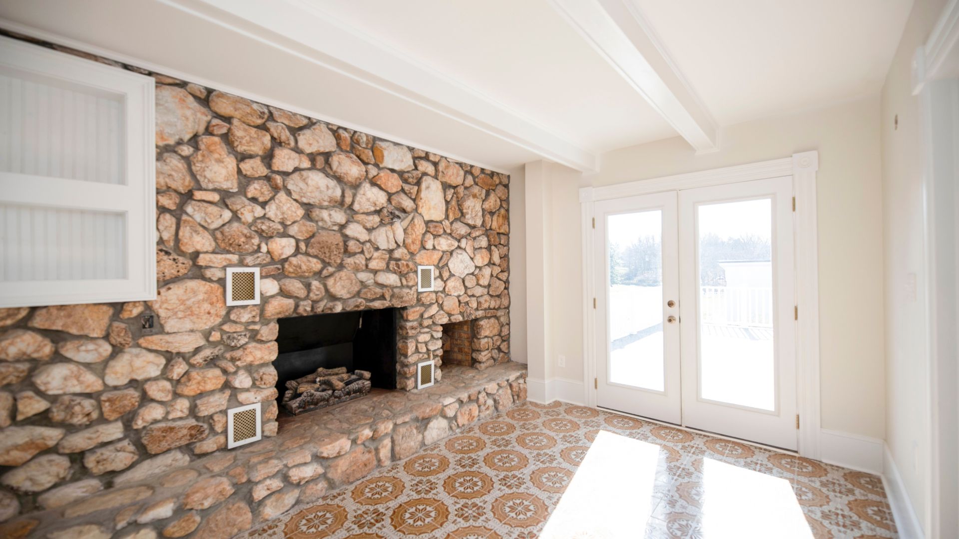 A stone wall and fireplace