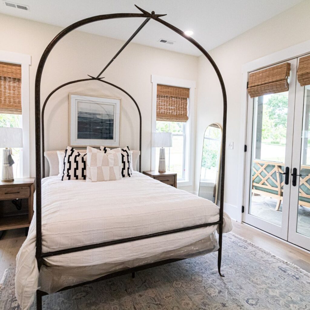 bed with iron framed canopy