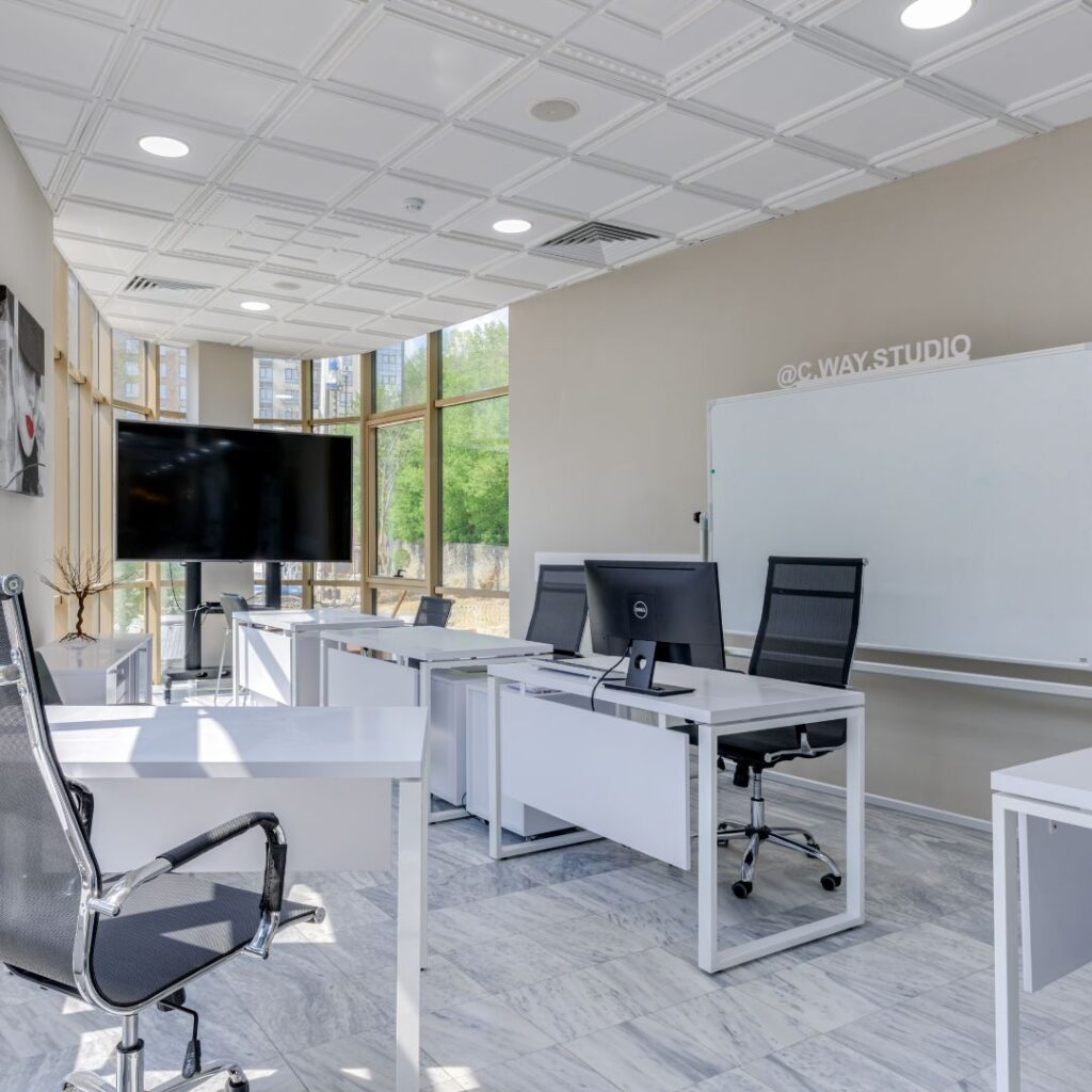 office space with computer and television